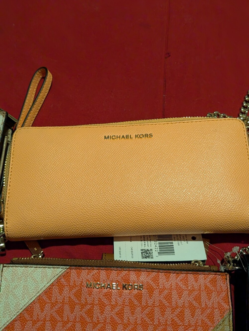 Michael Kors Peach Leather Wristlet Clutch with Gold Logo